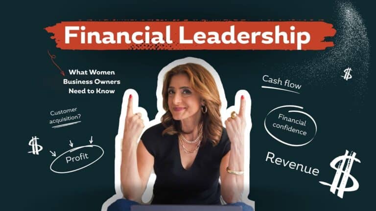 Woman business owner reviewing key financial numbers and reports at her desk