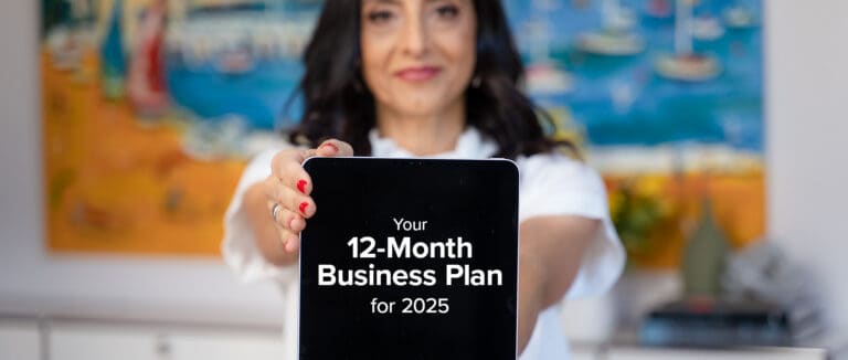 Woman business owner working through her 12-month business plan
